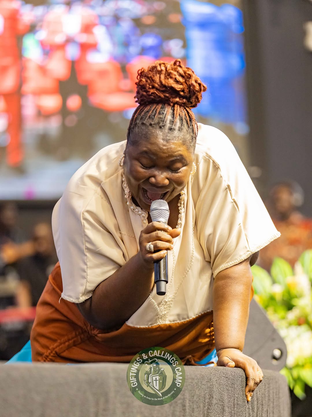 Mercy Sinclear singing during a worship gathering