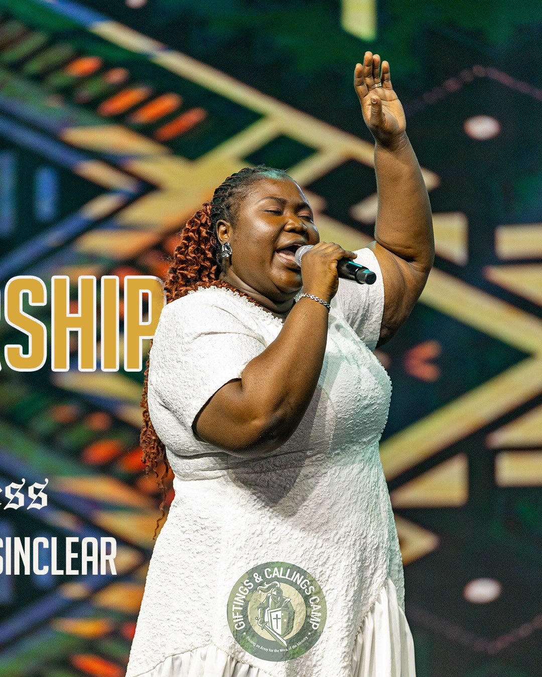 Mercy Sinclear singing with one hand raised